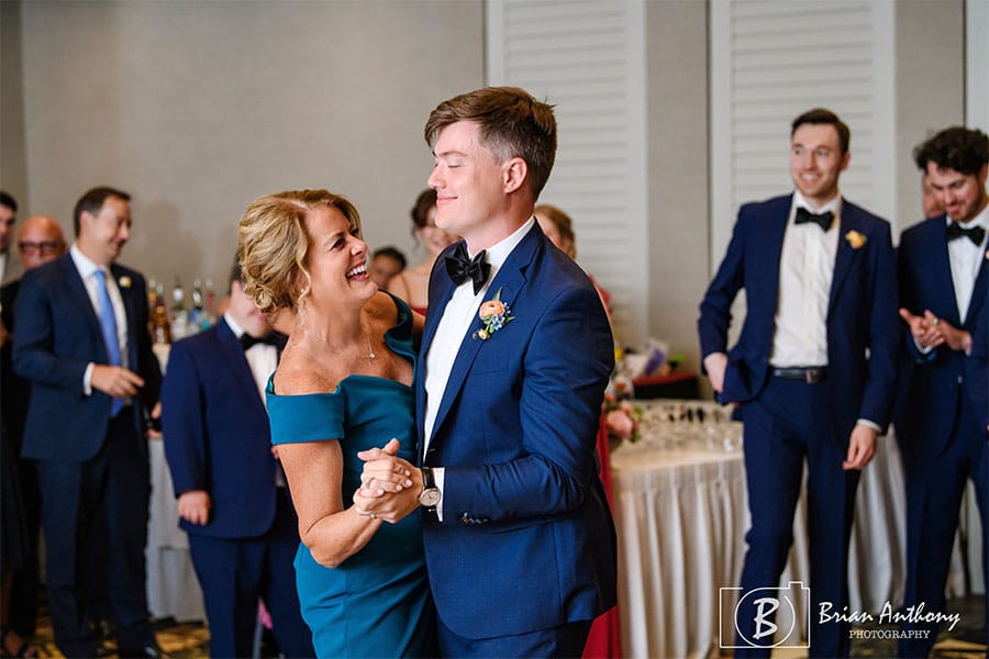 The groom dancing with his mom.