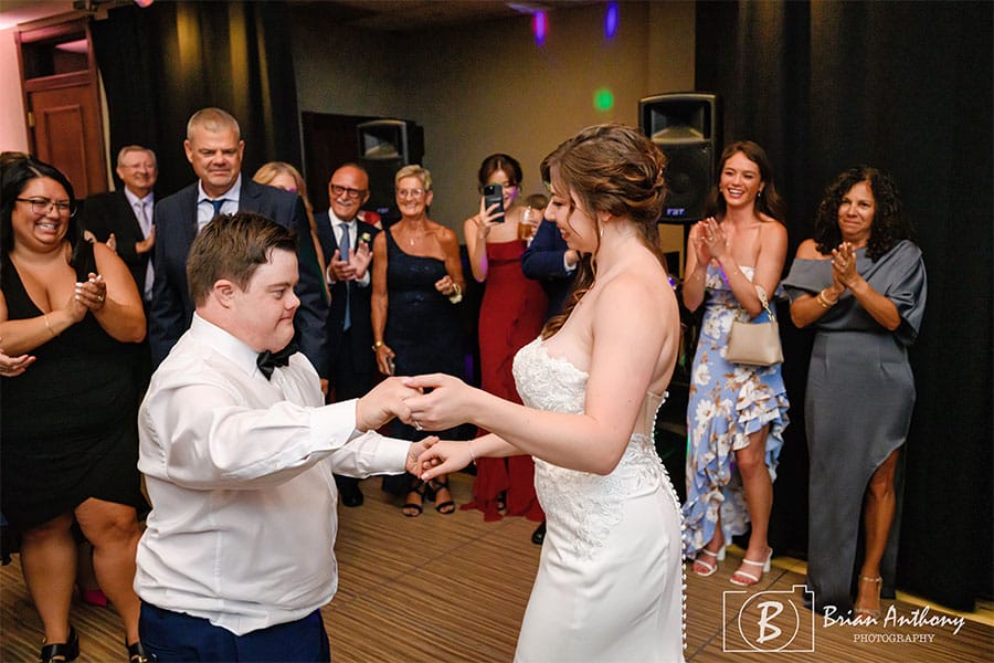 The bride dancing with one of her loved ones.