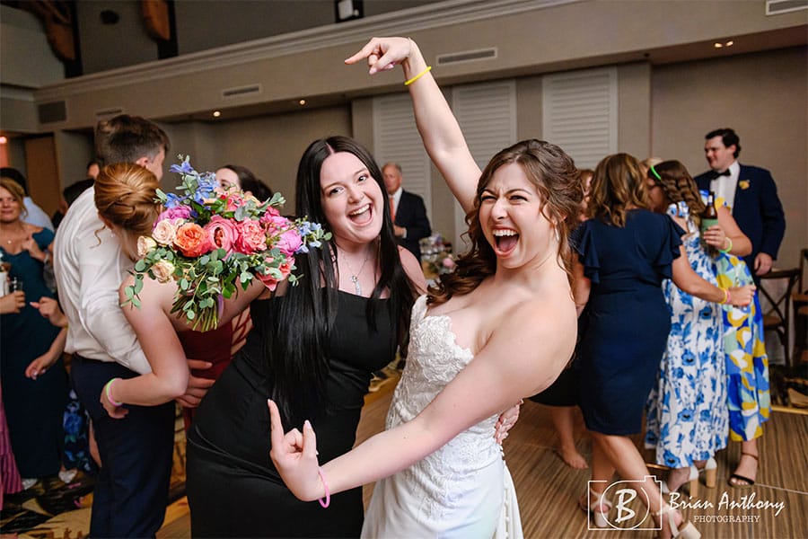 The bride with one of her loved ones who caught the flower from the flower toss.