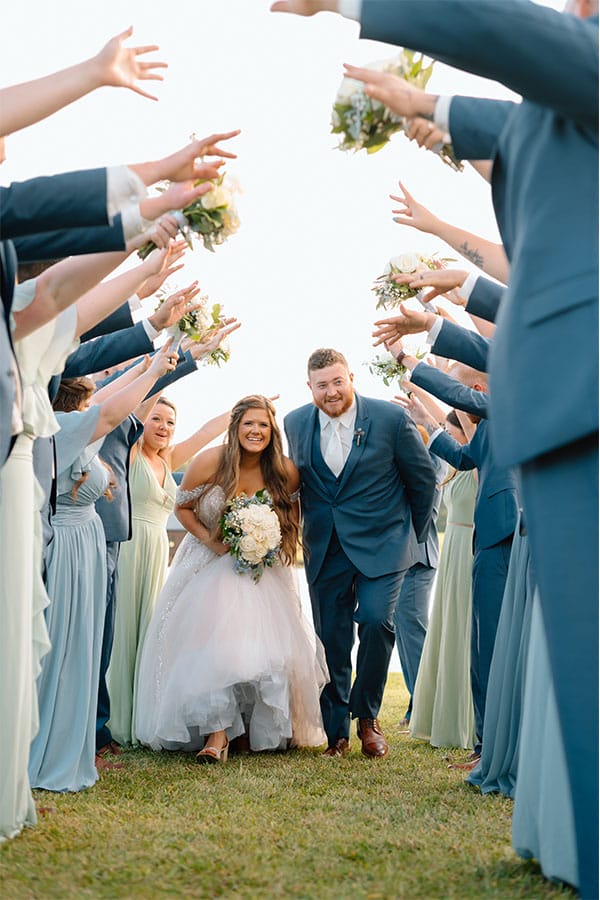 The bride and groom with their bridesmaids ands groomsmen.