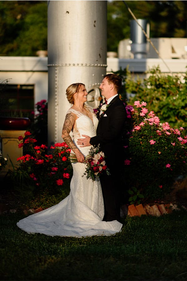 The bride and groom looking at each other.