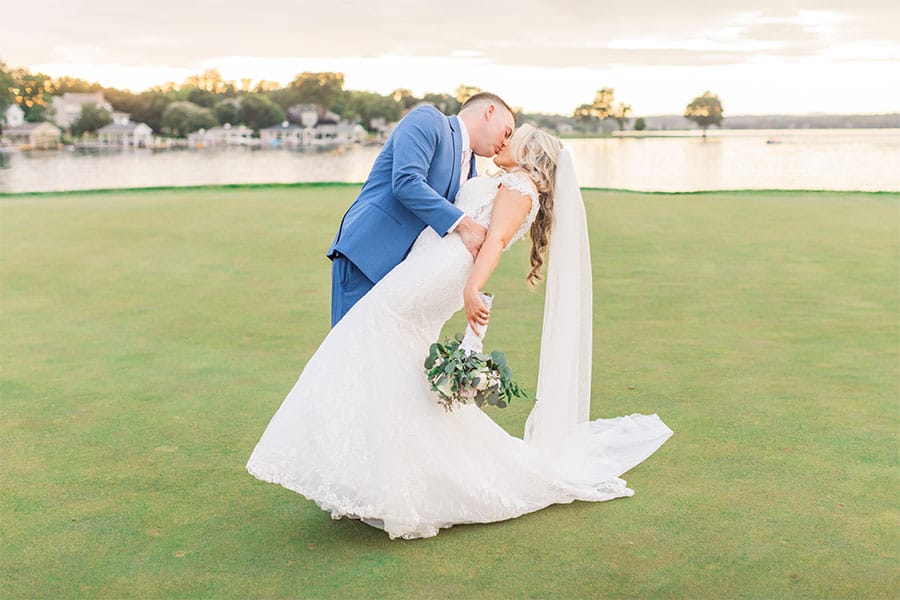 The bride and groom kissing.