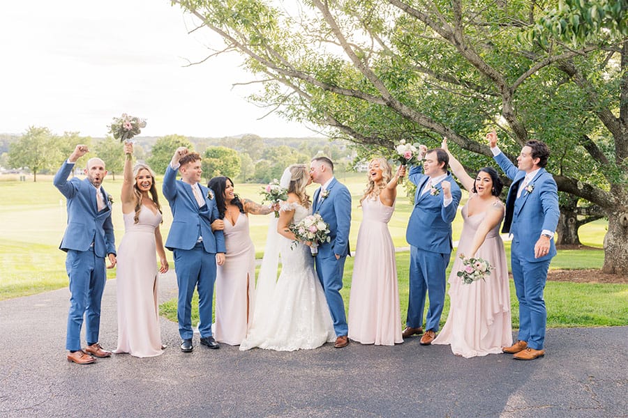 The bride and groom with their bridesmaids and groomsmen.