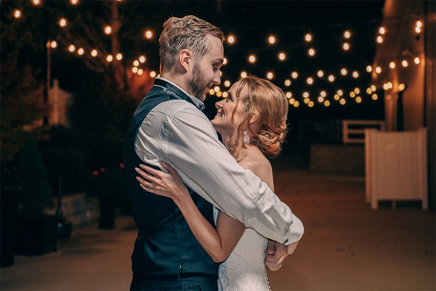 The bride and groom dancing together.