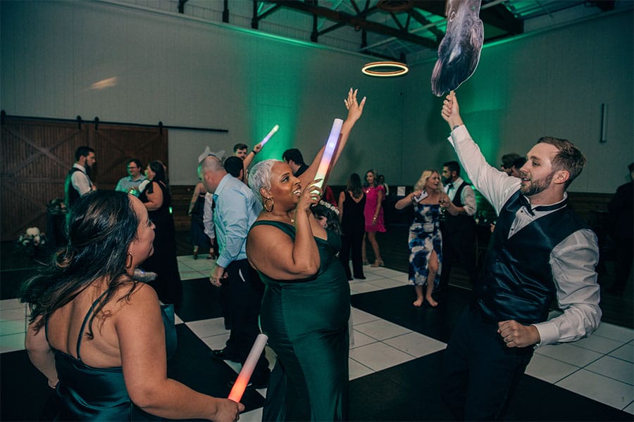 Family and friends dancing at a wedding.