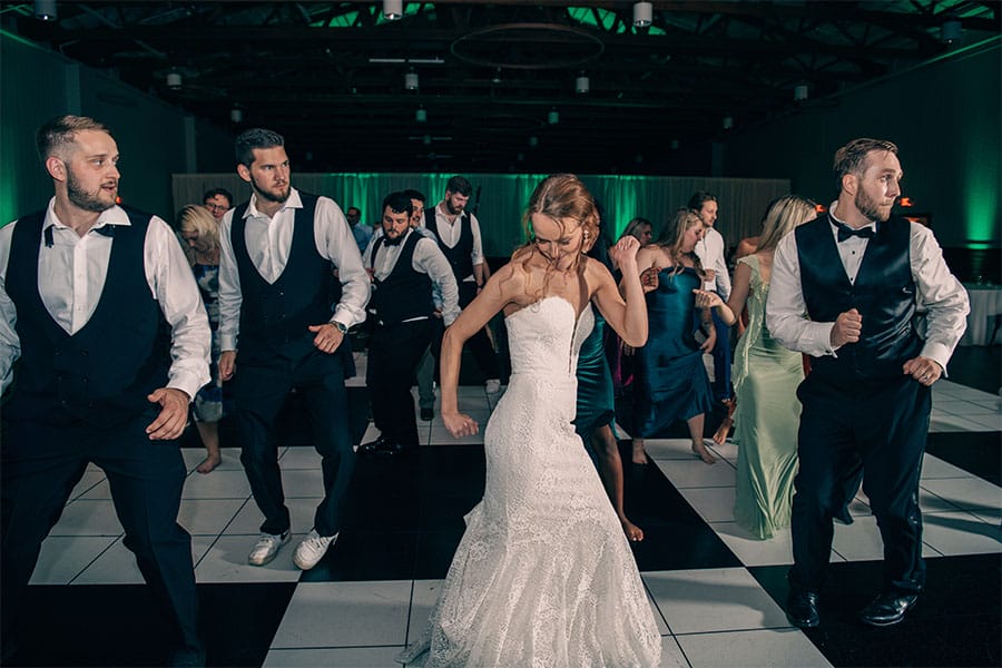 The bride dancing.
