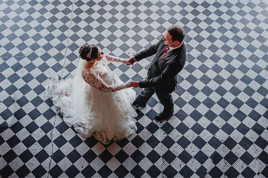 The bride and groom dancing together.