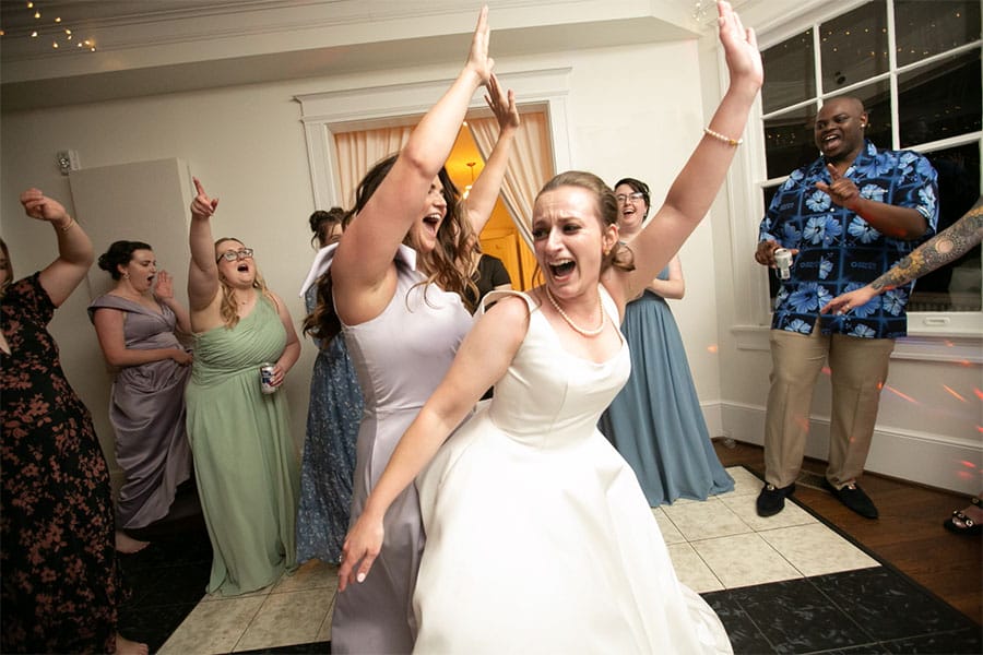 The bride dancing.