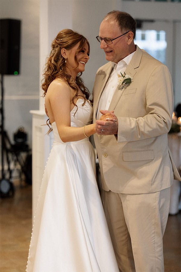 The bride dancing with her father.