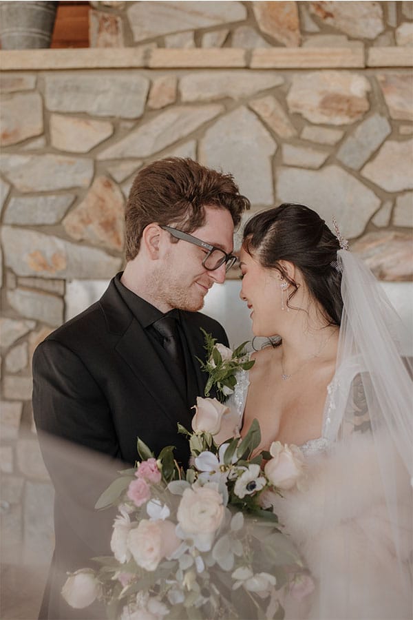 The bride and groom looking at each other.