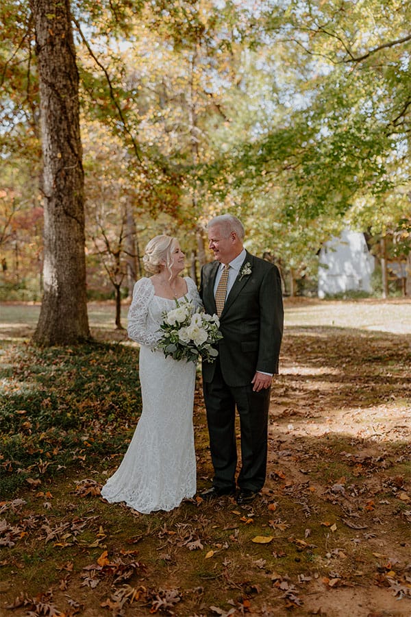 The bride and groom looking at each other.