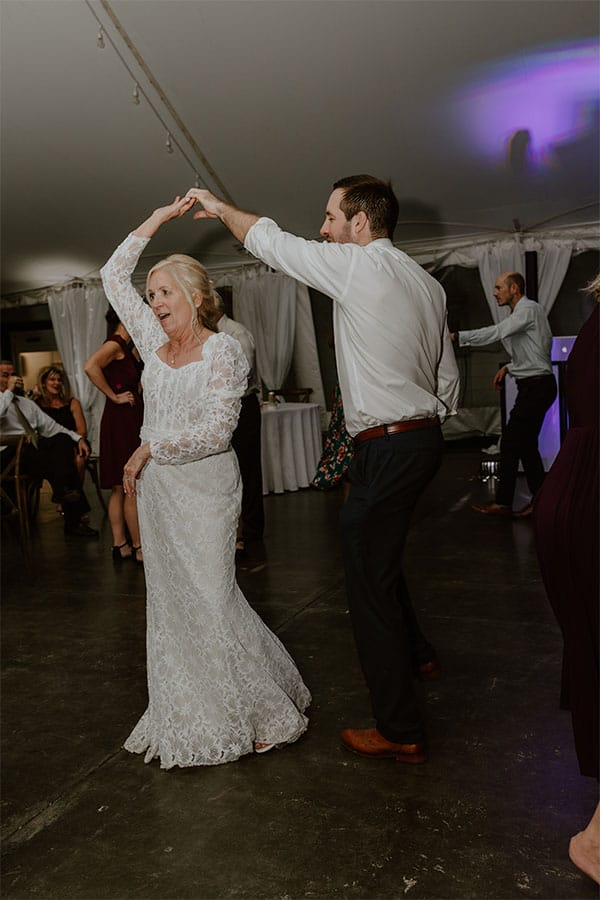 The bride dancing.