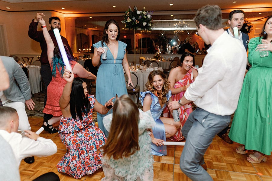 Family and friends of the couple dancing.