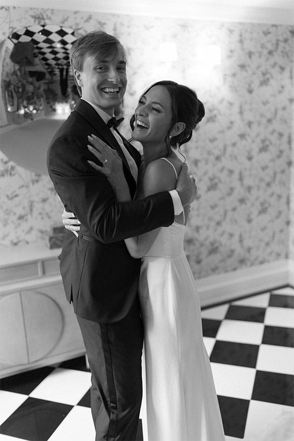 The bride and groom hugging eachother.