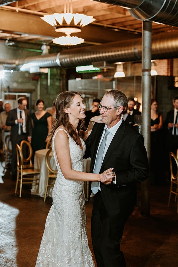 The bride dancing with her father.