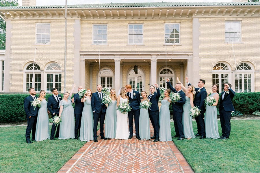 The bride and groom with their bridesmaids and groomsmen.
