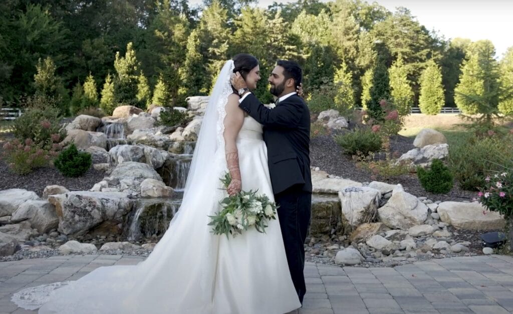 The bride and groom kissing.