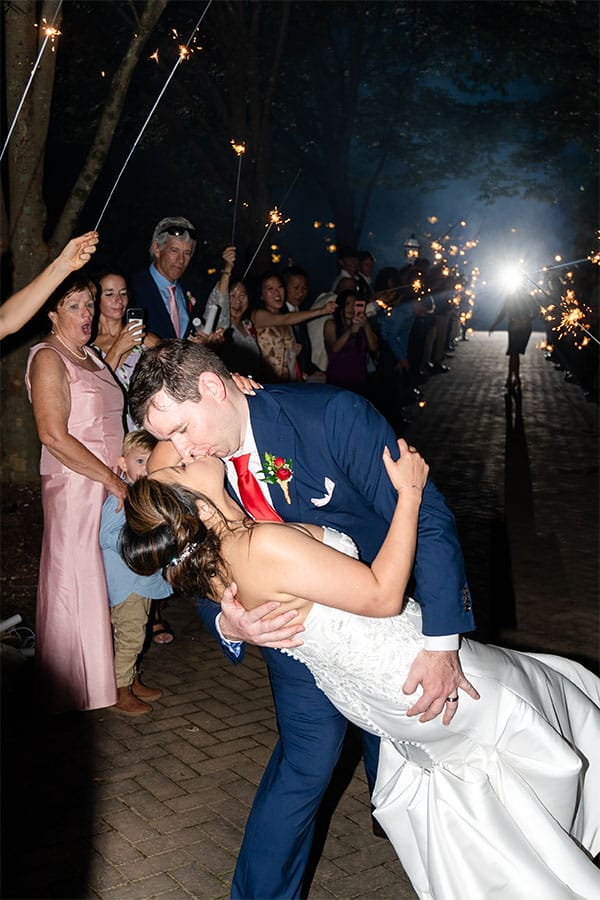 The bride and groom kissing.